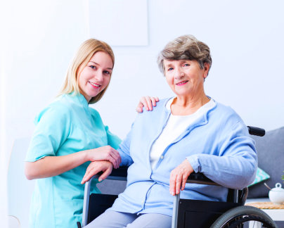 elderly and caregiver smiling