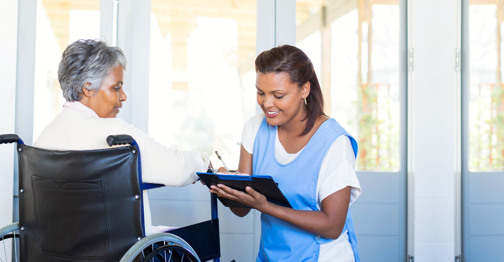caregiver taking care of elderly